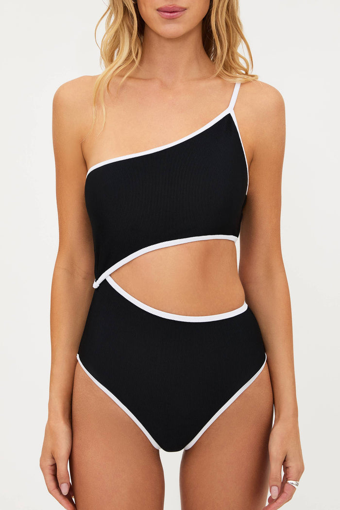Black one-shoulder swimsuit with white trim on a white background