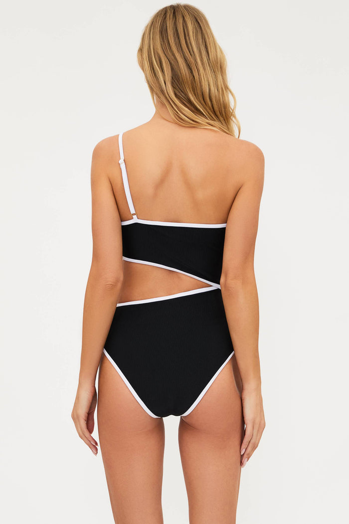 Black and white swimsuit with cut-out design on a white background