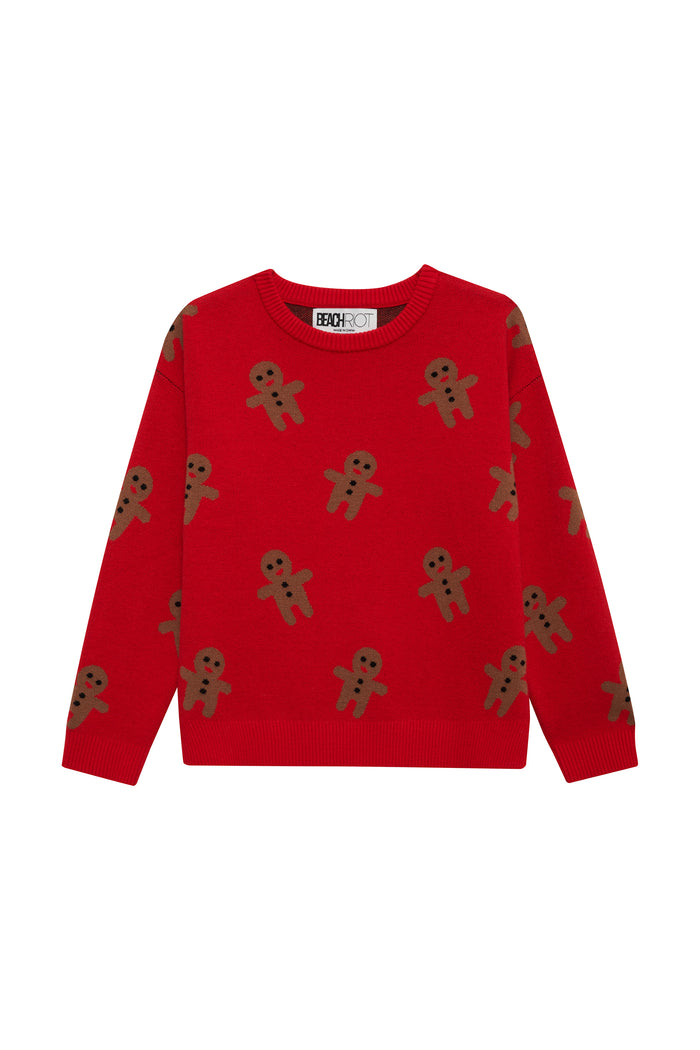 Red sweater with gingerbread man pattern on a white background