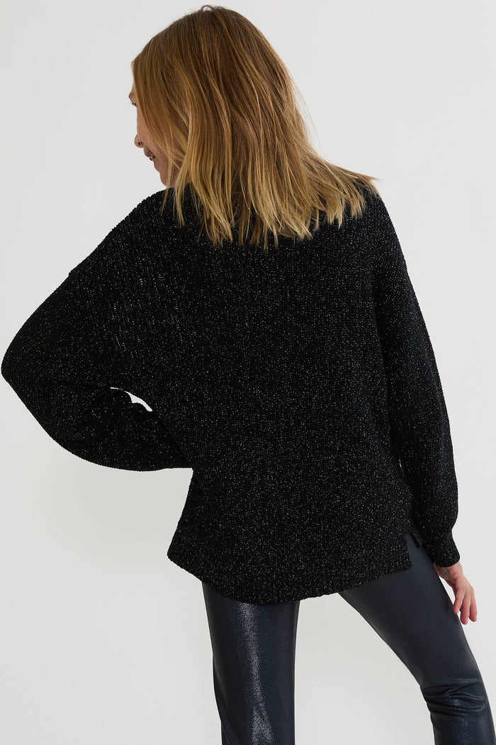 Kids black sweater with silver shimmer.