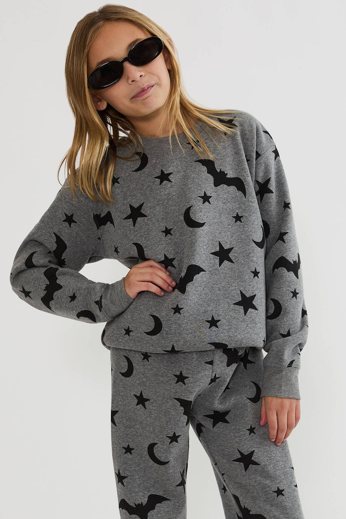 Kids grey sweatshirt with black stars, moons, and bats.