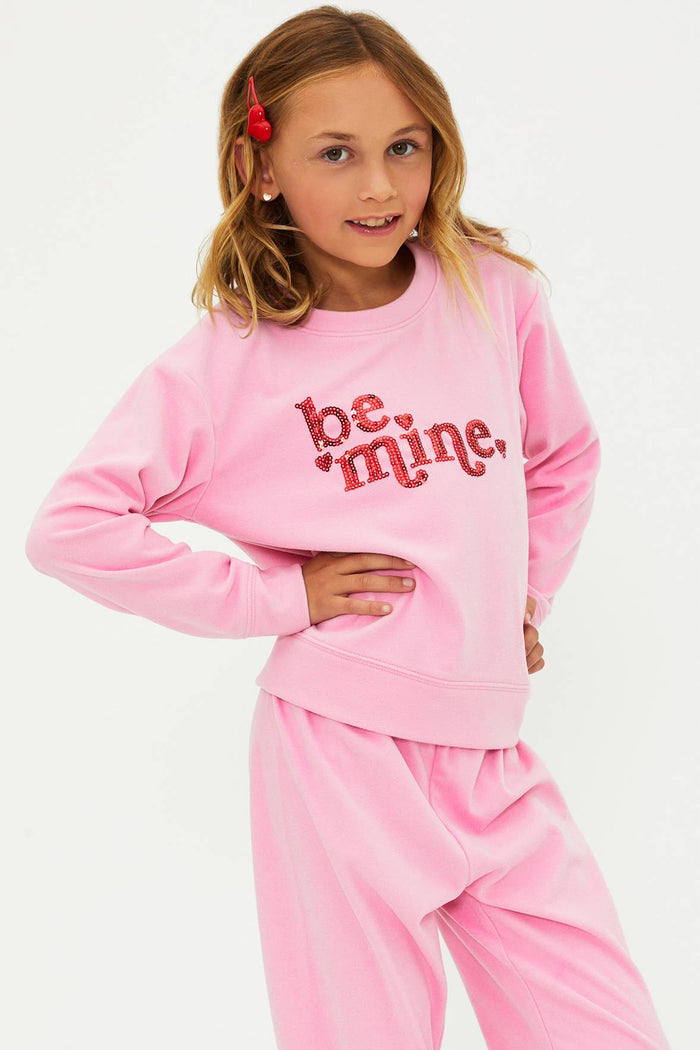 Pink sweatshirt with red glitter "be mine" text