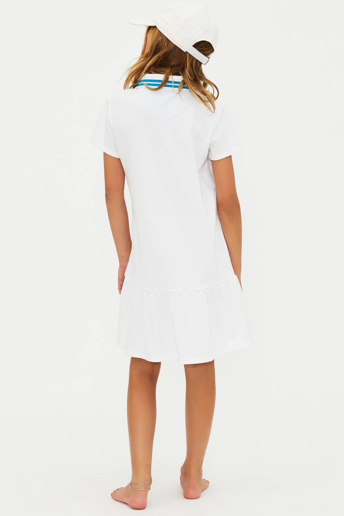 Person wearing a white dress with a blue stripe on a white background