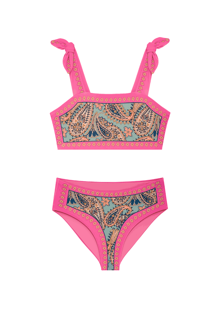 A two-piece bikini set featuring a bright pink base with a central paisley pattern in teal, beige, and brown, and gold geometric borders. The top has tie-shoulder straps, and the bottom is high-waisted.