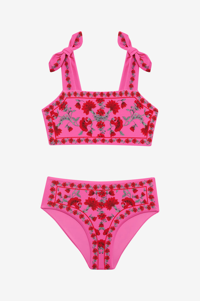 Pink bikini set with floral design on a white background