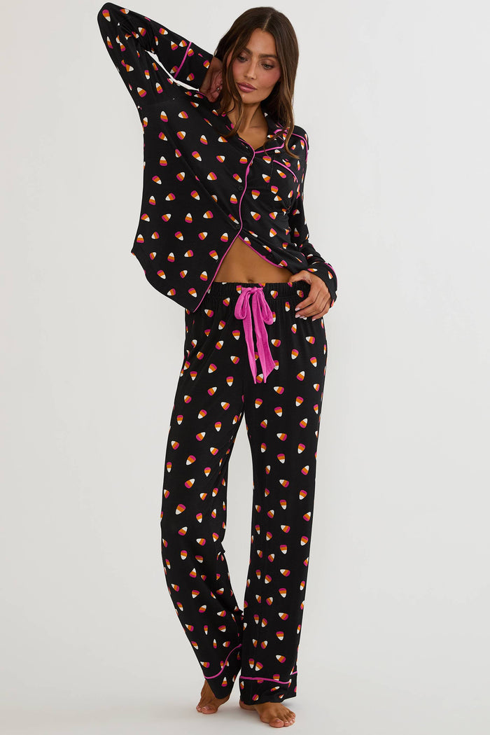Long sleeve and pant pajama set with candy corns printed on.