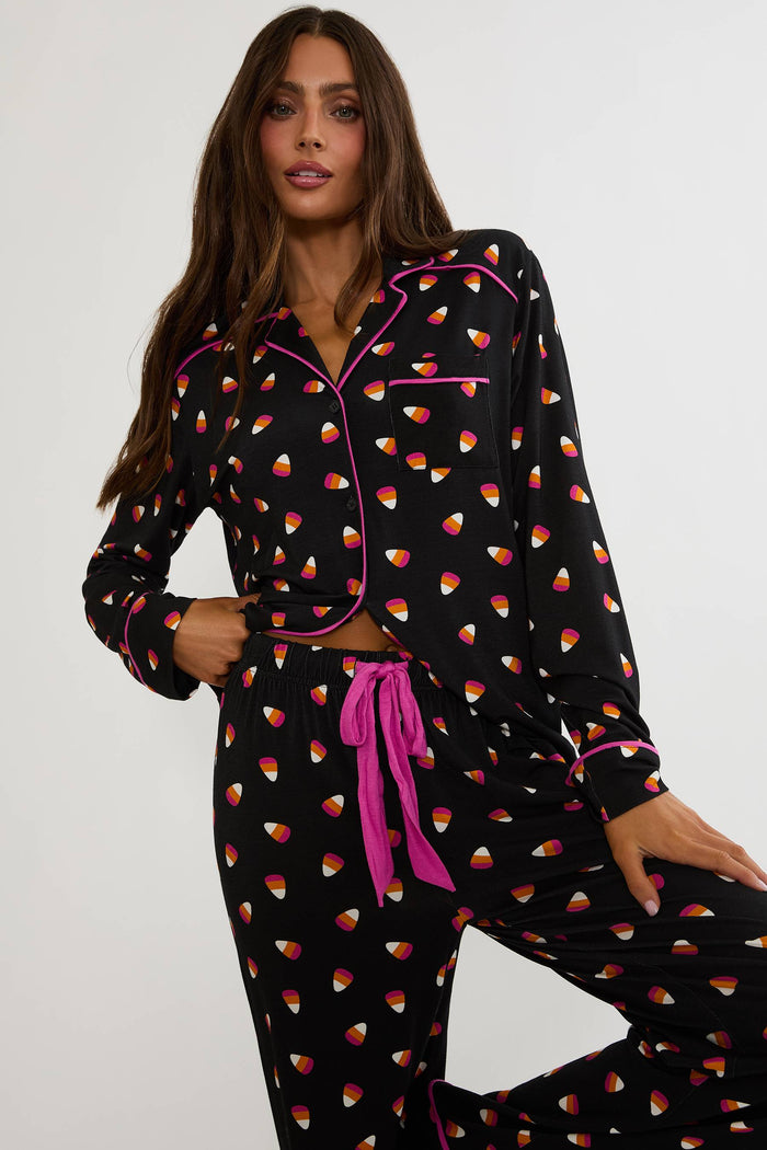 Long sleeve and pant pajama set with candy corns printed on.