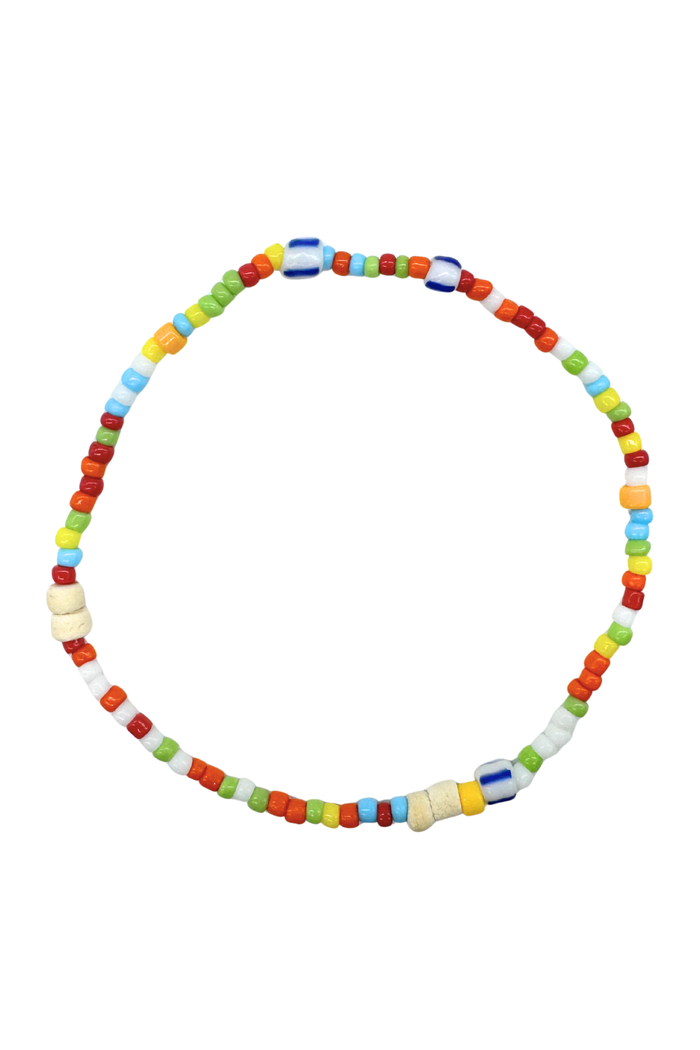 A beaded necklace made of small multicolored cylindrical beads in red, orange, yellow, green, blue, and cream, arranged in a circle on a plain white background.