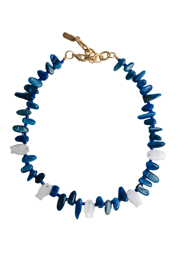 A beaded necklace featuring alternating translucent blue and opaque white disc-shaped beads, finished with a gold-tone lobster clasp, shown on a plain white background.