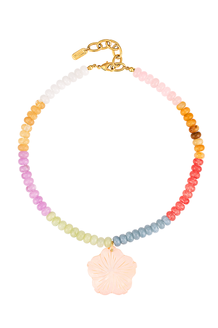 A beaded necklace with a rainbow gradient of small round beads and a central pale pink flower-shaped charm, finished with a gold clasp on a white background.