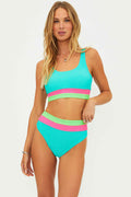 Woman wearing a colorful two-piece swimsuit on a white background