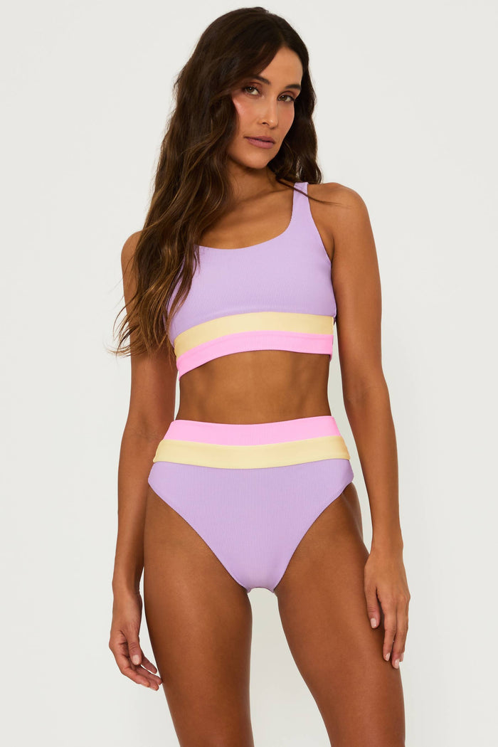 purple ribbed bikini set with pink and yellow stripped colorblock at the underband and waist