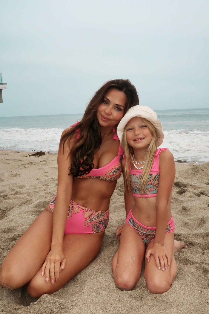 matching mother and daughter in paisley swimsuits