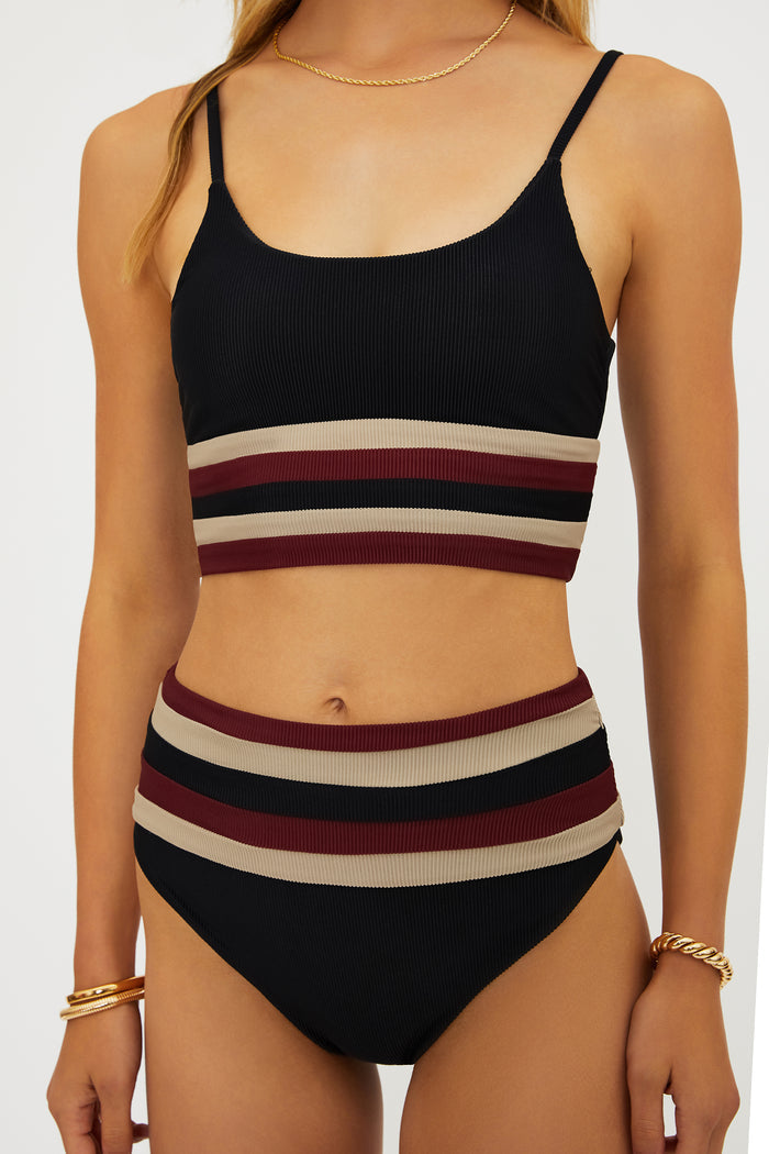 Black bikini with horizontal stripes on a white background
