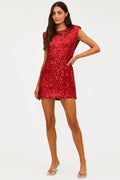 Woman wearing a red sequin dress on a white background