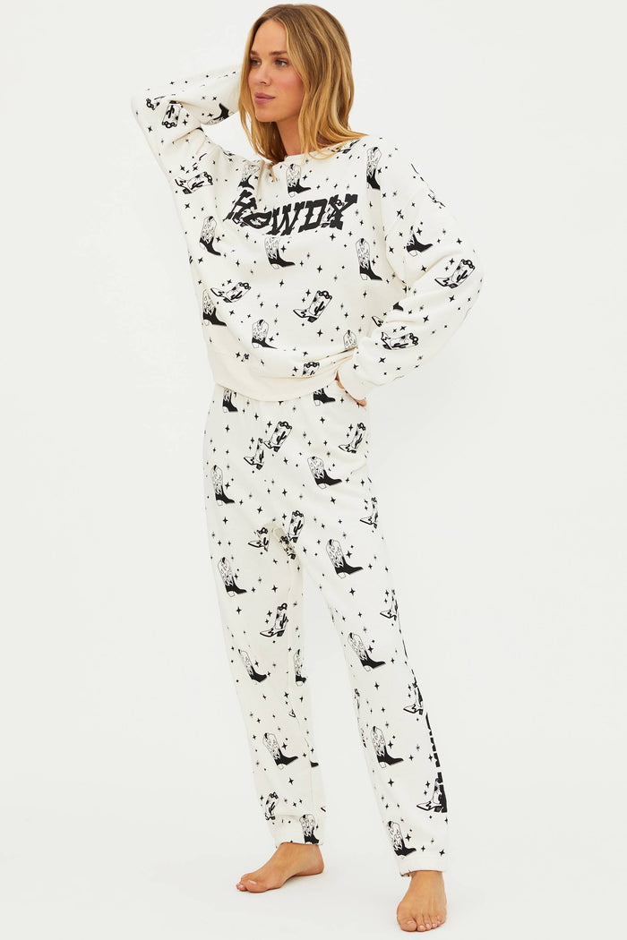 Person wearing a white onesie with black patterns on a white background