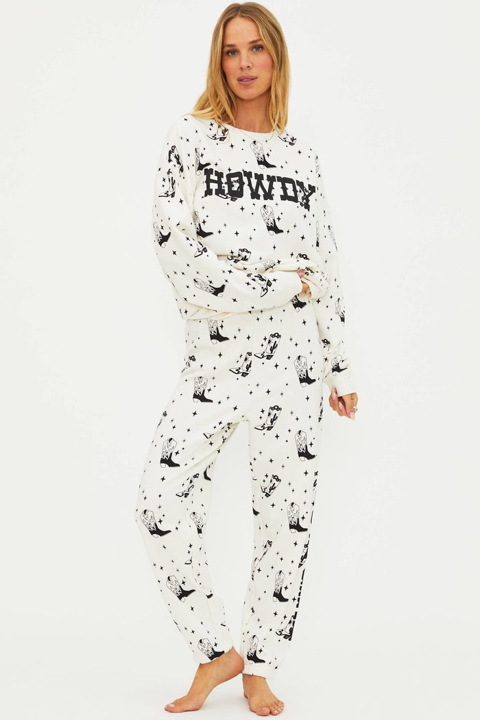 Person wearing a black and white pajama set with 'HOWDY' text on a white background