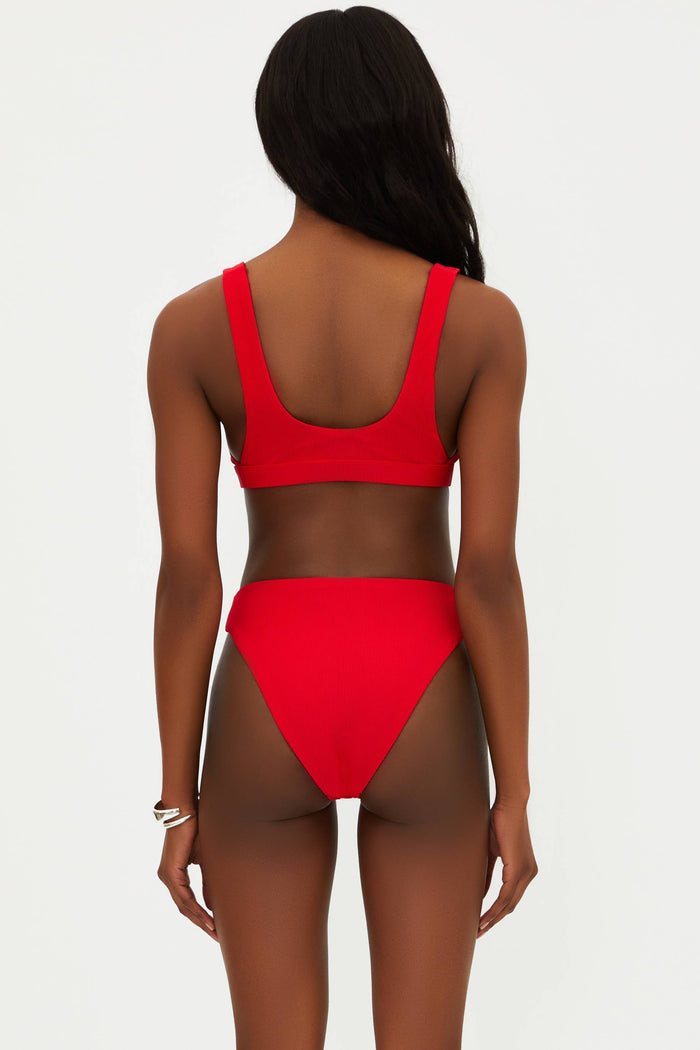 A red bikini top with a scoop neck and fixed straps, made from ribbed fabric.