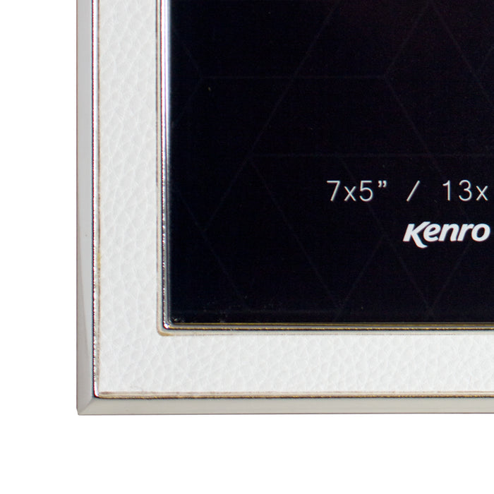 Corner of Piazza Classic silver-plated photo frames with white leather inlay on white background