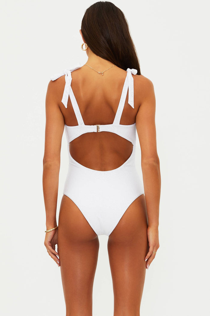 White swimsuit with cut-out design on a white background