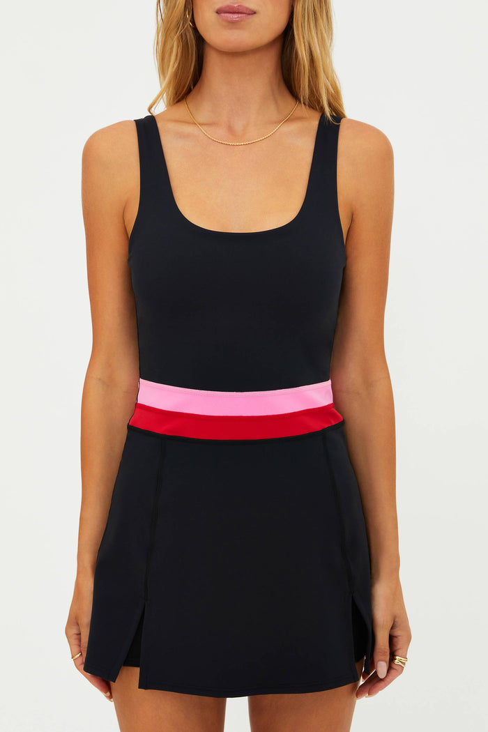 Black dress with pink and red band on a white background