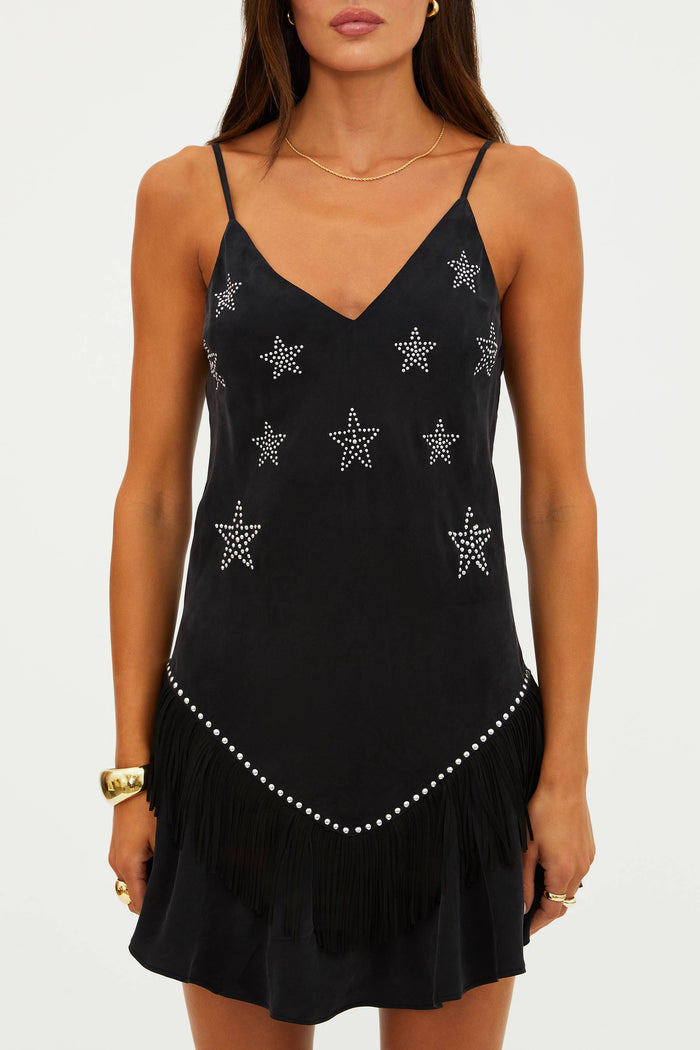 Black dress with star patterns on a white background