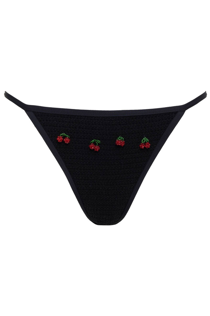 Black bikini bottom with cherry embroidery on a white background