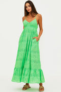 Woman wearing a green lace dress on a white background