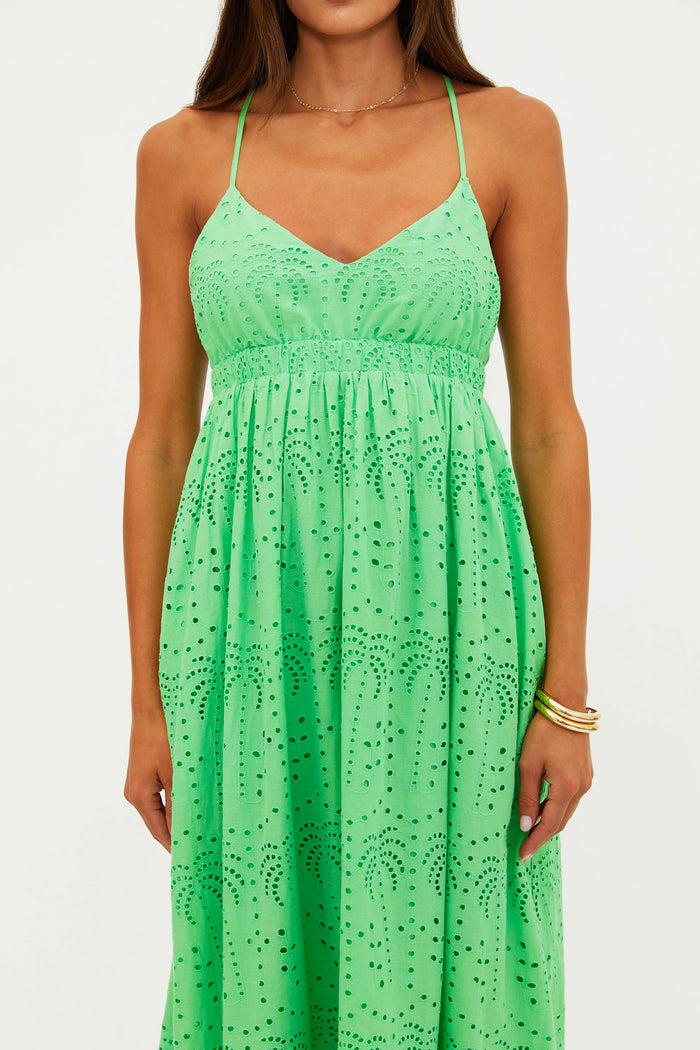 Green dress with floral pattern on a white background