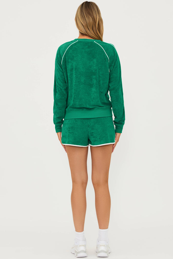 green velour long sleeve top with a white contrast trim and matching shorts