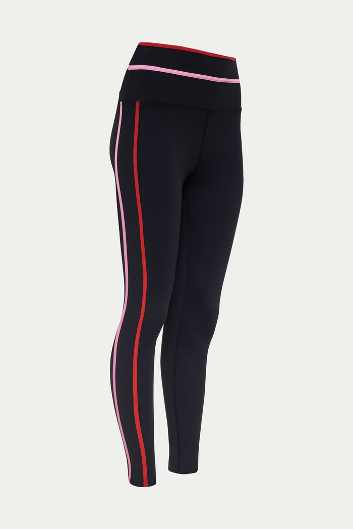 Black leggings with red and white stripes on a light gray background