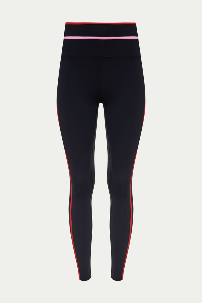 Black leggings with red and pink accents on a light gray background