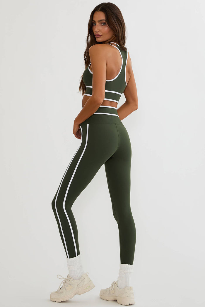 Olive green legging with white piping on the side and on the waist.
