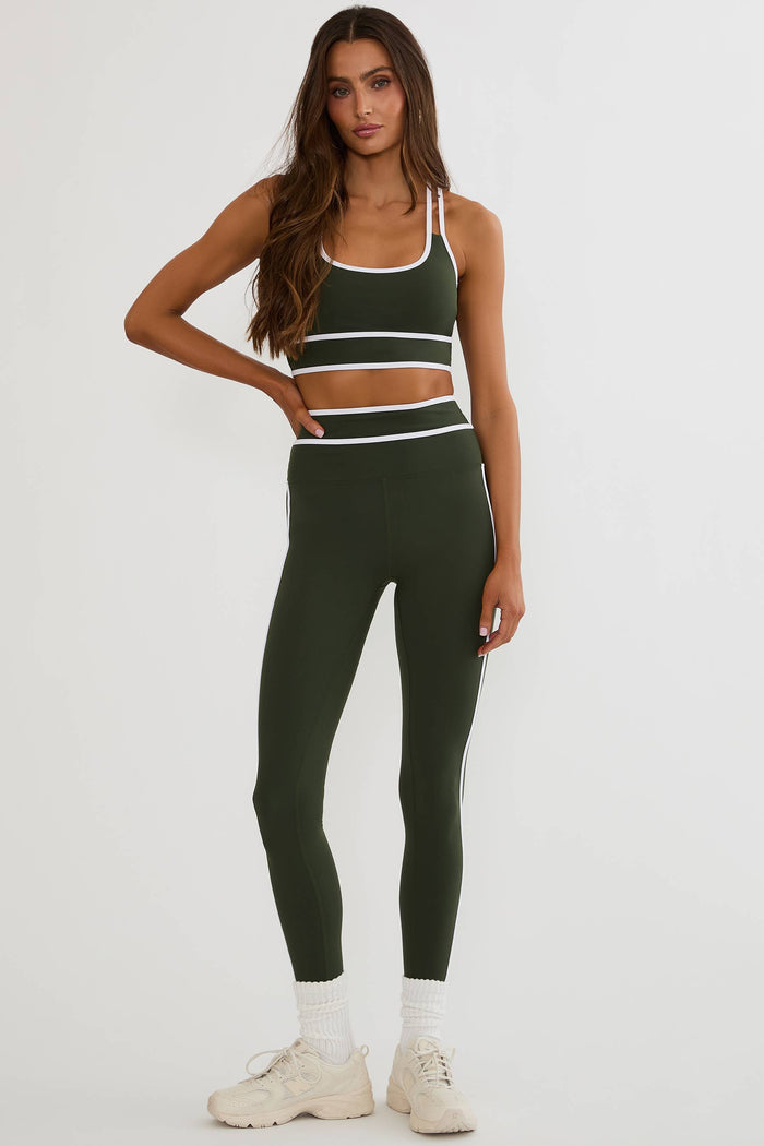 Olive green legging with white piping on the side and on the waist.