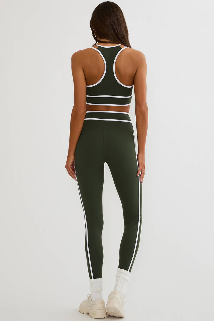 Olive green legging with white piping on the side and on the waist.