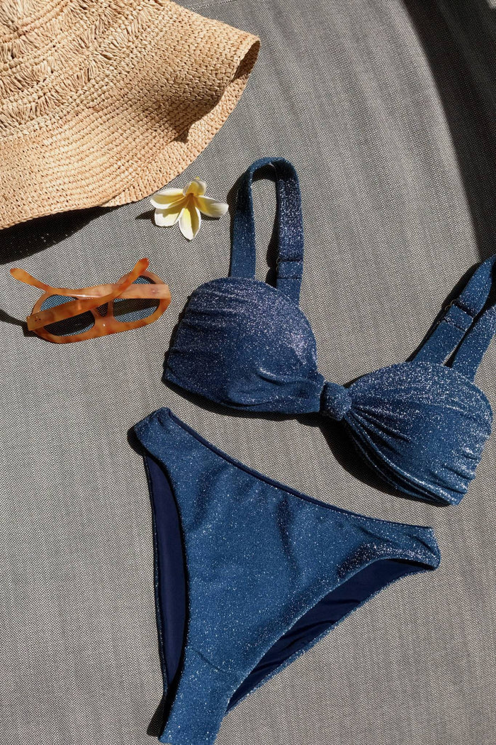 High cut swim bottoms, with navy blue base and silver sparkles.