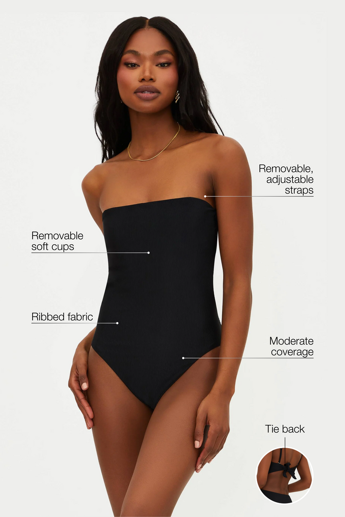 Black strapless swimsuit with labeled features on a white background