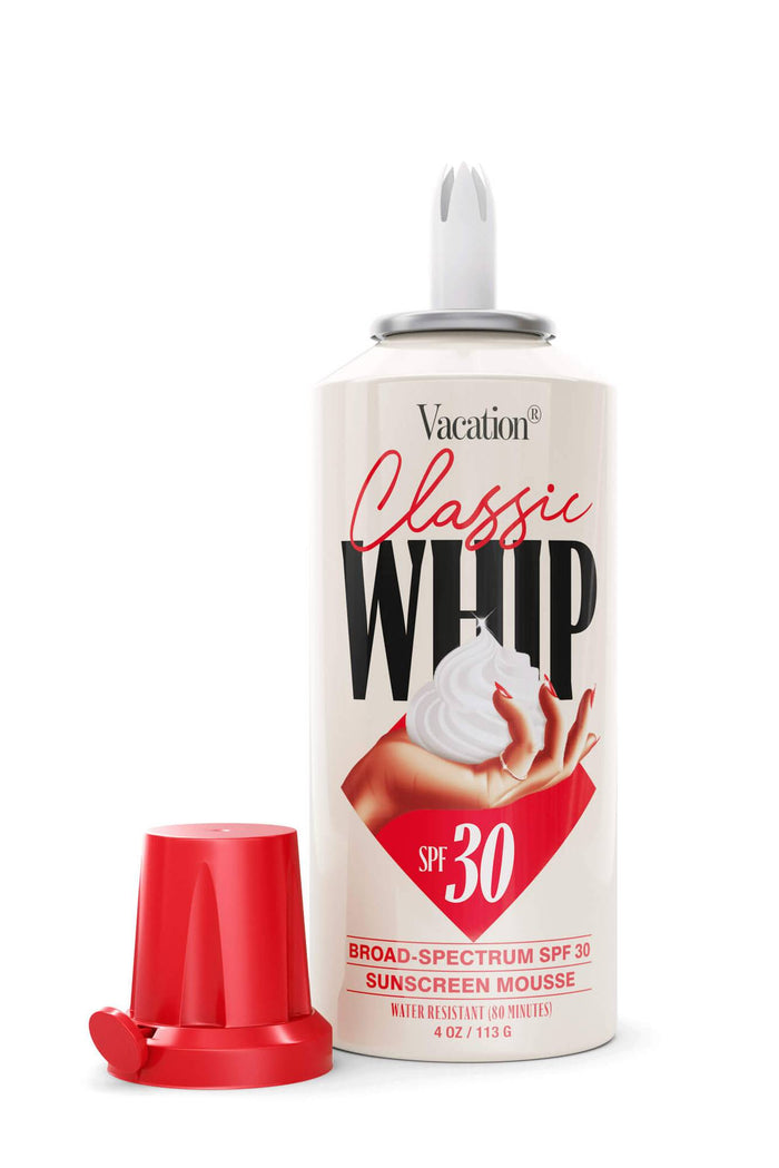 A pump bottle of Vacation Classic Whip Sunscreen with SPF 30, featuring an image of a perfect mount of sunscreen and the brand logo.
