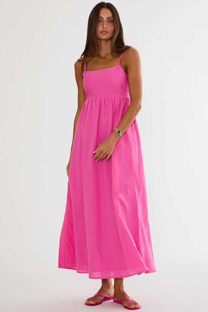 Woman wearing a pink dress on a white background