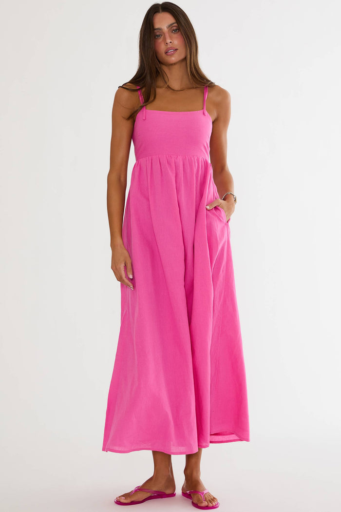 Woman wearing a pink dress on a white background